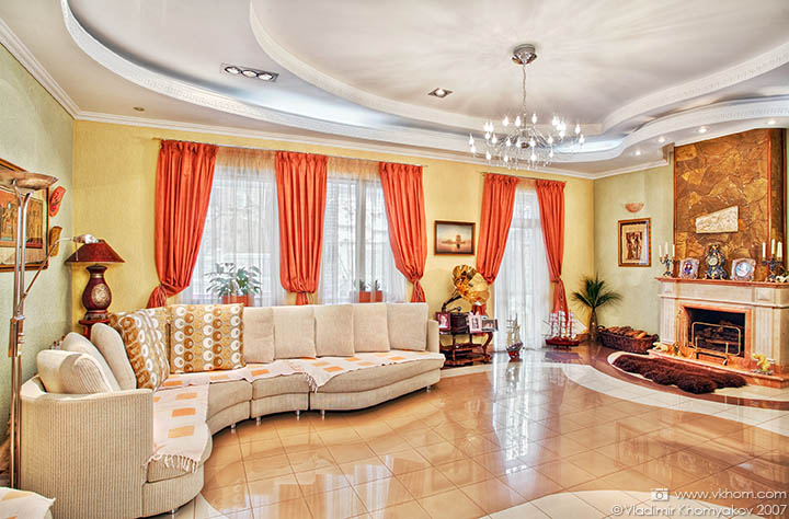 The living room with fireplace in the private house